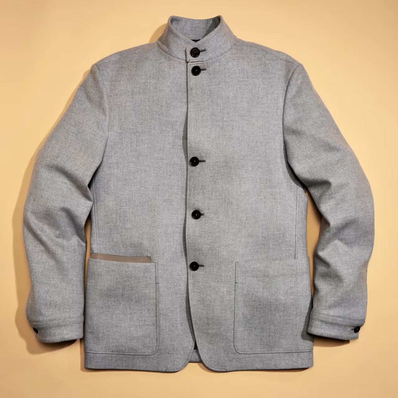 the rise of the rich guy grey jacket